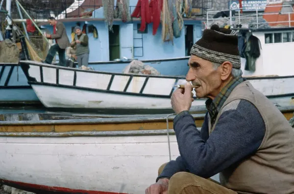 fisherman cigarette Fisherman Smokes Cigar on Istanbul Waterfront Print, 1979. Art Prints,  Posters & Puzzles from Fine Art Storehouse