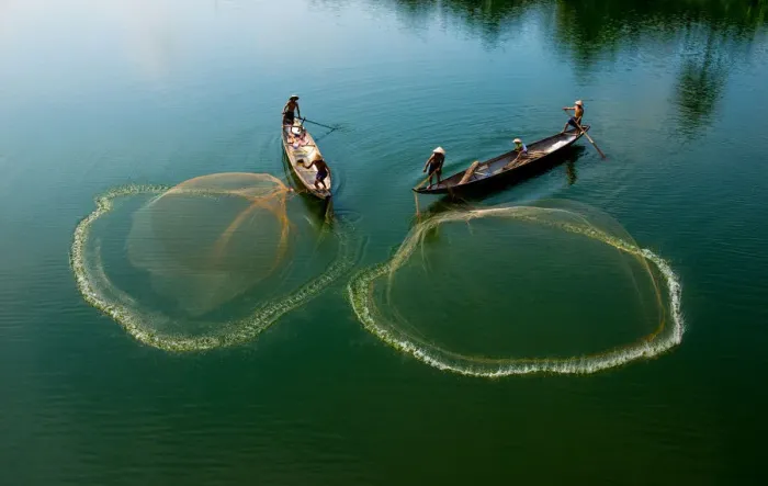 Framed Print : Fishermen go fishing on two boats in Hue, Vietnam Framed Print : Fishermen go fishing on two boats in Hue, Vietnam