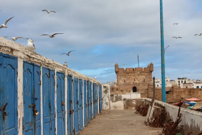 Framed Print : Fishermens huts and Genoese-built citadel in Essaouira harbour, on Atlantic coast of Morocco