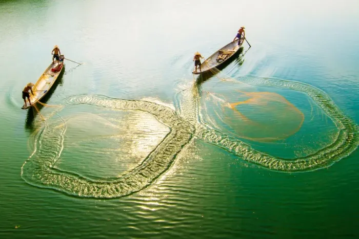 Framed Print : Fishing men on boat in river in Hue, Vietnam Framed Print : Fishing men on boat in river in Hue, Vietnam