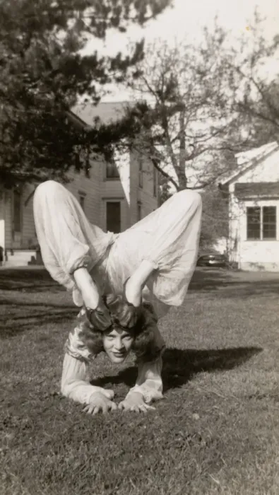 Framed Print : Flexible Woman in a Garden Bending Her Legs Above Her Head Framed Print : Flexible Woman in a Garden Bending Her Legs Above Her Head