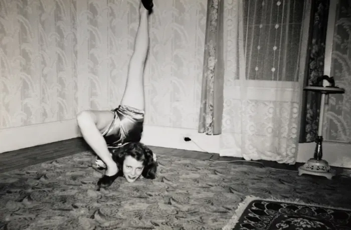 Framed Print : Flexible Woman on the Living Room Floor With Her Leg Over Her Head Framed Print : Flexible Woman on the Living Room Floor With Her Leg Over Her Head