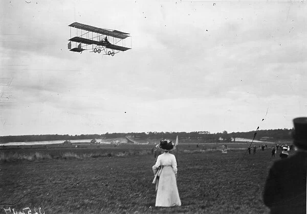 In flight. August 1910: Blondeau in flight (on a Farman bi-plane) over