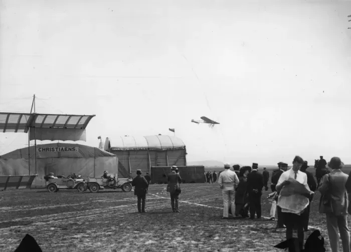 Framed Print : In Flight. July 1910: Planes flying over the hangars at a Bournemouth Aviation meeting Framed Print : In Flight. July 1910: Planes flying over the hangars at a Bournemouth Aviation meeting