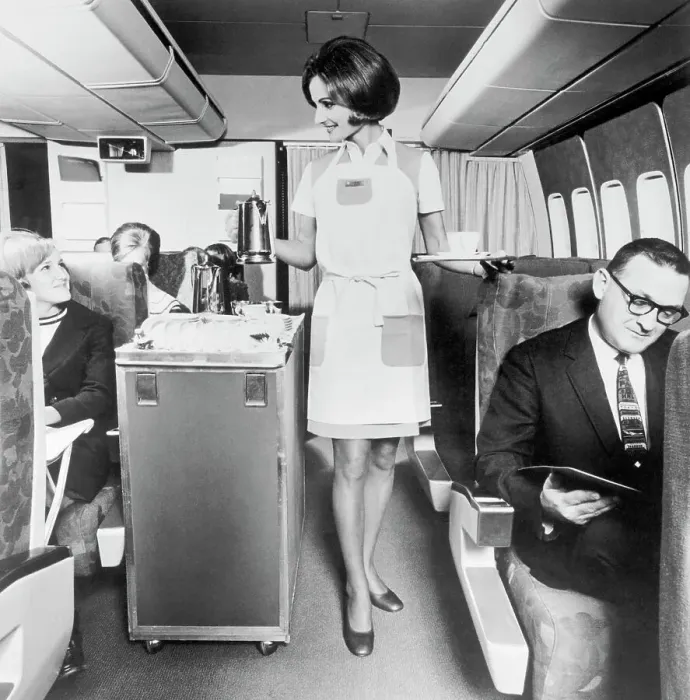 Framed Print : Flight Attendant Serving Coffee Framed Print : Flight Attendant Serving Coffee