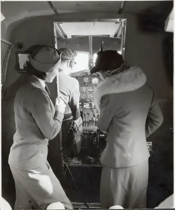Framed Print : Flight Attendant Shows Woman Cockpit