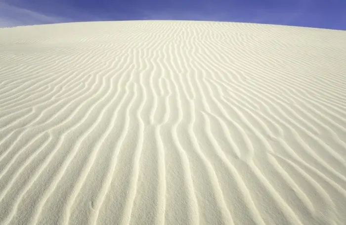 Framed Print : Flowing patterns and shapes created by wind on white gypsum sand dunes Framed Print : Flowing patterns and shapes created by wind on white gypsum sand dunes