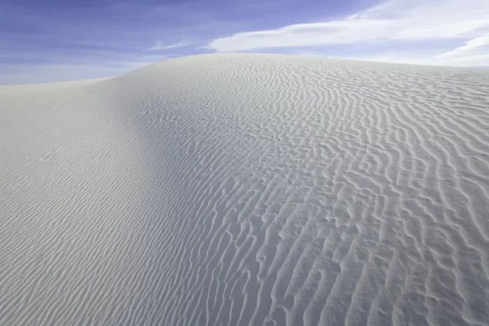 Framed Print : Flowing patterns and shapes created by wind on white gypsum sand dunes