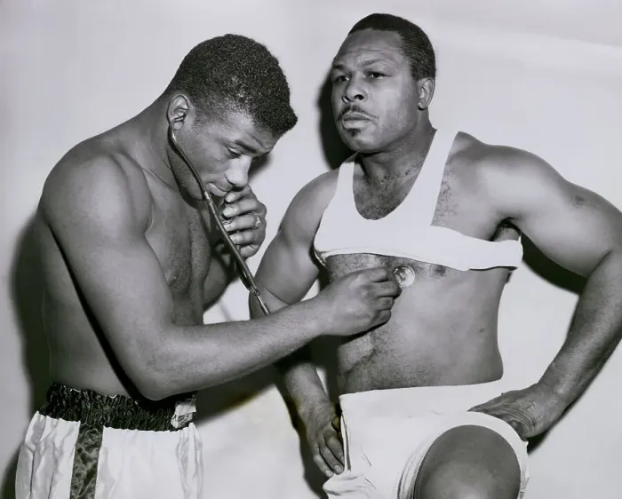 Framed Print : Floyd Patterson Listening to Archie Moore's Heart Framed Print : Floyd Patterson Listening to Archie Moore's Heart