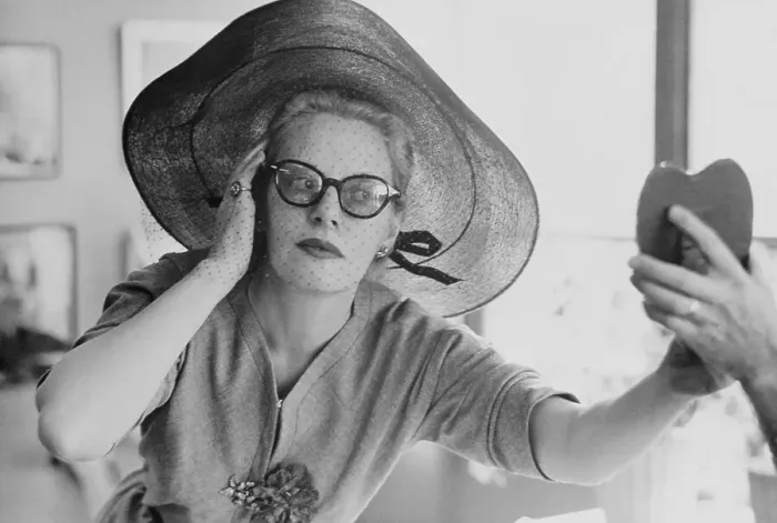 Framed Print : Fluer Cowles Trying on Hat Framed Print : Fluer Cowles Trying on Hat