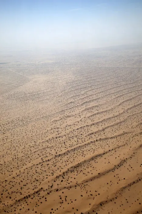 Framed Print : Flying over a settlement in the desert of the United Arab Emirates, with scattered habitation, a road and agriculture. The desert merges with the sky Framed Print : Flying over a settlement in the desert of the United Arab Emirates, with scattered habitation, a road and agriculture. The desert merges with the sky