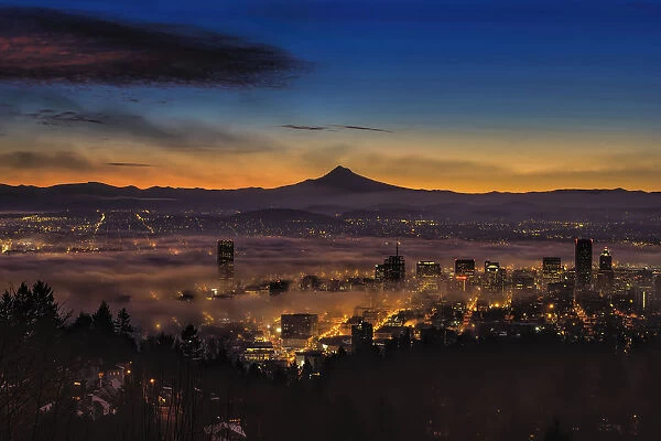Fog rolling in at dawn over the city of Portland