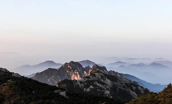 Fog rolling over Mount Huangshan (Yellow Mountain or Mt. Huangshan), Anhui Province, China
