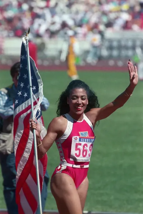 Framed Print : Folrence Joyner-Griffiths Carrying American Flag