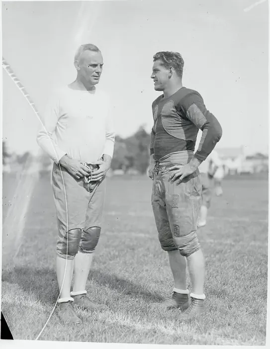 Framed Print : Football Coach and Captain Conversing Framed Print : Football Coach and Captain Conversing