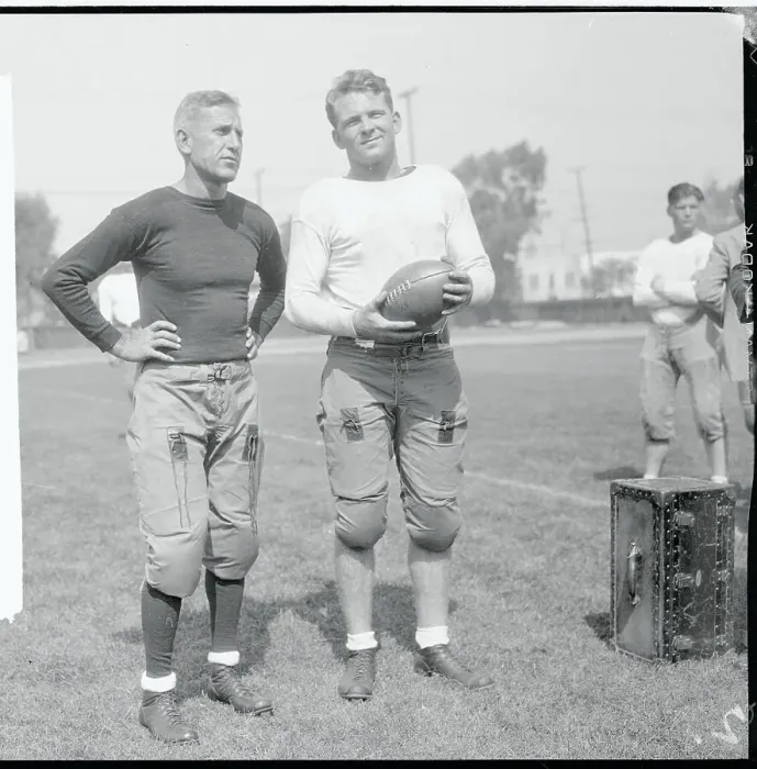 Framed Print : Football Coach with One of His Teammates Framed Print : Football Coach with One of His Teammates