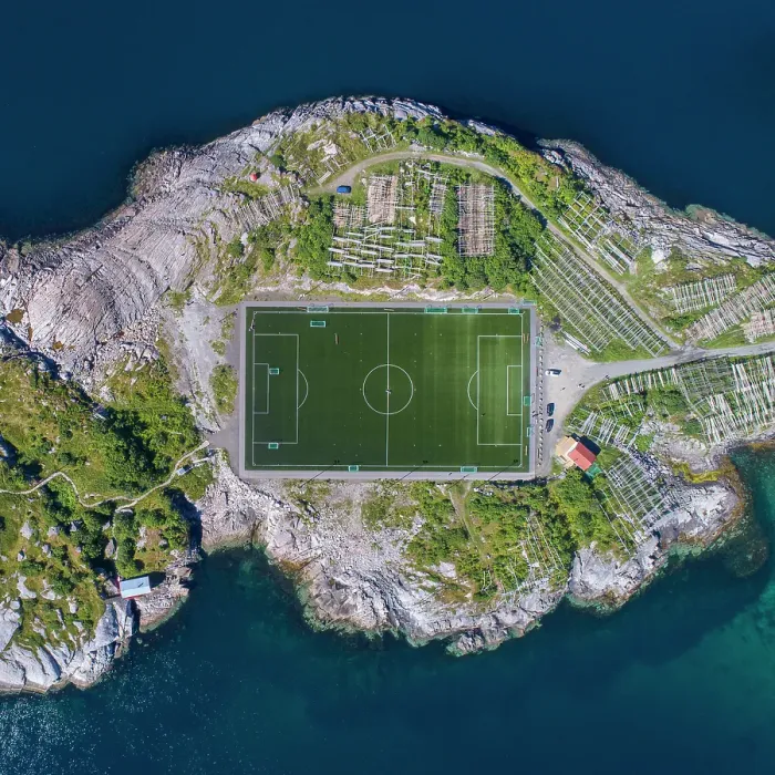 Framed Print : Football field in Henningsvaer from above. Henningsvaer is a fishing village located on several small islands in the Lofoten archipelago in Norway Framed Print : Football field in Henningsvaer from above. Henningsvaer is a fishing village located on several small islands in the Lofoten archipelago in Norway