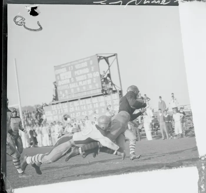 Framed Print : Football Player Breaking Free from Tackle Framed Print : Football Player Breaking Free from Tackle