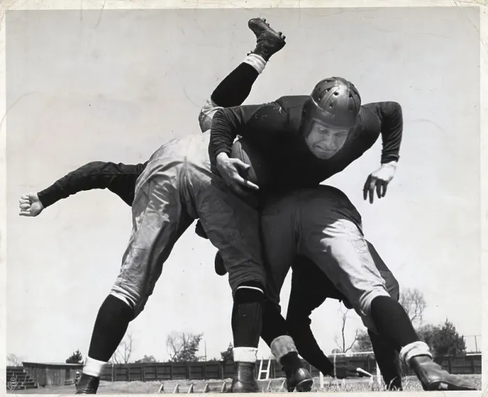 Framed Print : Football Player Bring Tackled Framed Print : Football Player Bring Tackled