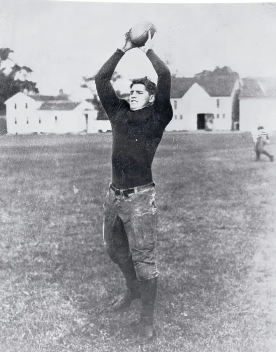 Framed Print : Football Player Holding Ball