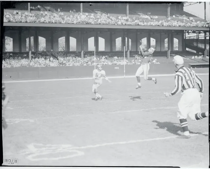 Framed Print : Football Player Intercepting a Pass