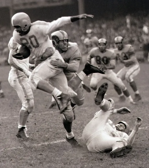 Framed Print : Football Player Leaping Through Air Framed Print : Football Player Leaping Through Air