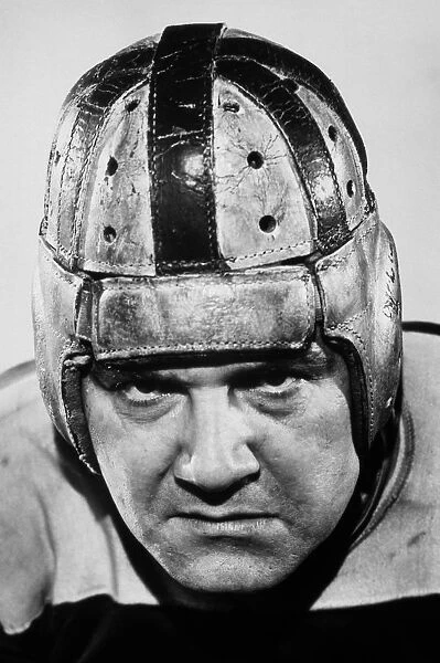 FOOTBALL PLAYER IN LEATHER HELMET, 1920s