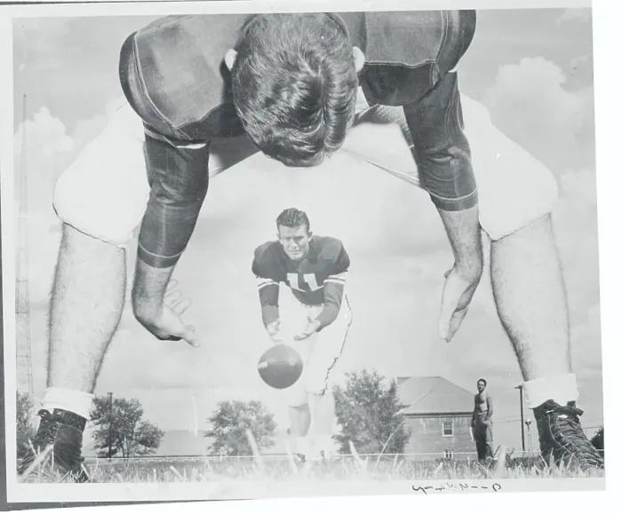 Framed Print : Football Player Passing Ball to Teammate Framed Print : Football Player Passing Ball to Teammate