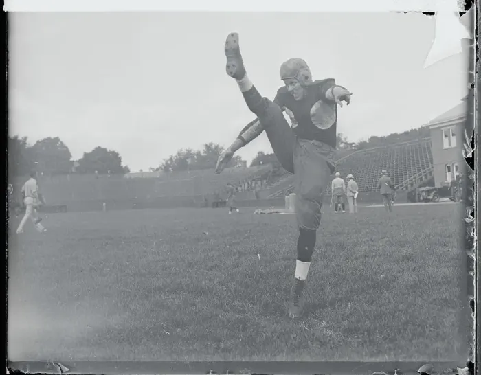 Framed Print : Football Player Practicing His Kicking Framed Print : Football Player Practicing His Kicking