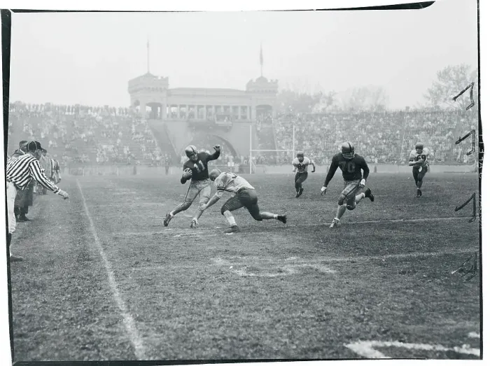 Framed Print : Football Player Tackling His Opponent Framed Print : Football Player Tackling His Opponent
