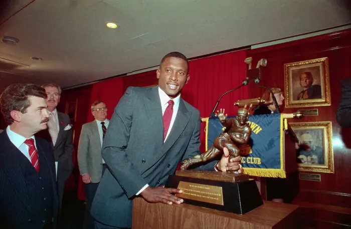 Framed Print : Football Player Tim Brown Posing by His Heisman Trophy Framed Print : Football Player Tim Brown Posing by His Heisman Trophy
