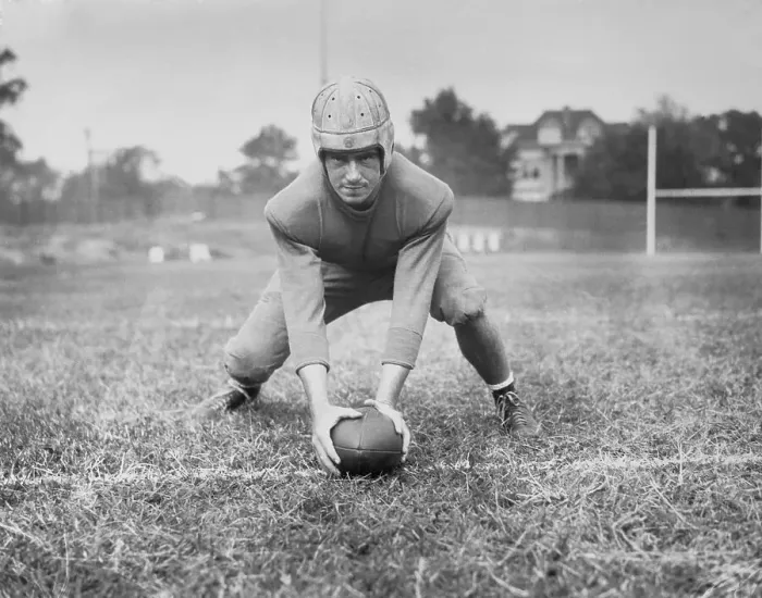 Framed Print : Football Player Val Kneeling with Football Framed Print : Football Player Val Kneeling with Football