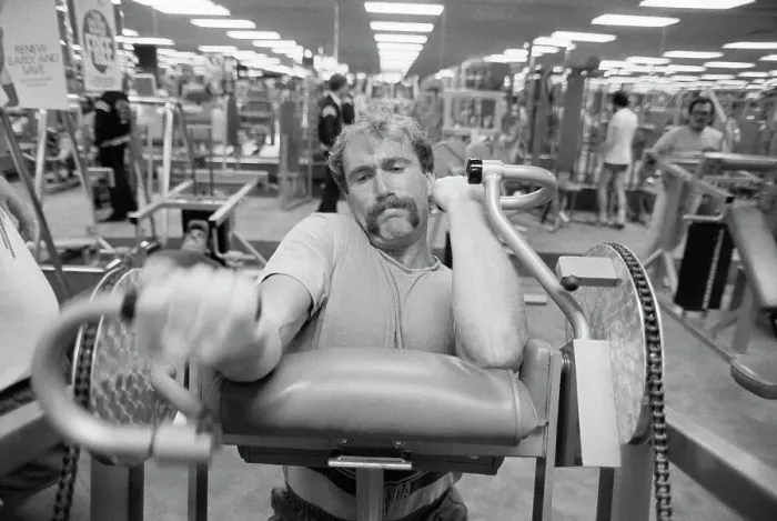 Framed Print : Football Player Working on Exercise Machine