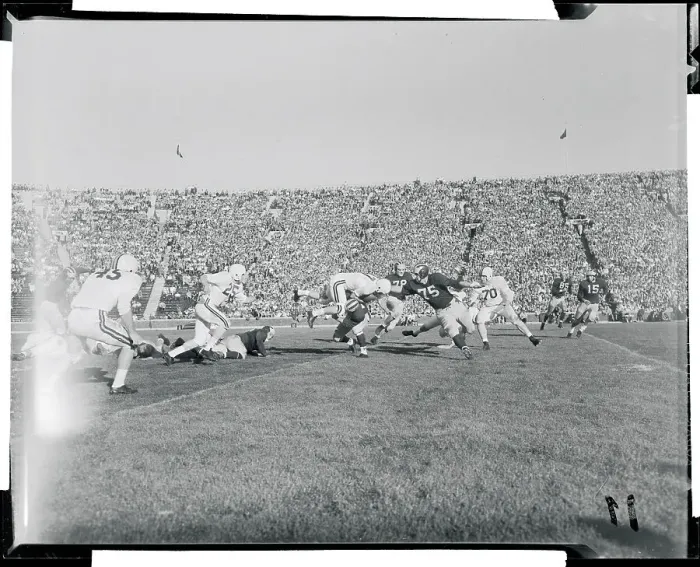 Framed Print : Football Players Competing in a Game Framed Print : Football Players Competing in a Game