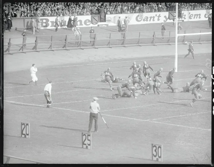 Framed Print : Football Players Competing in a Game Framed Print : Football Players Competing in a Game