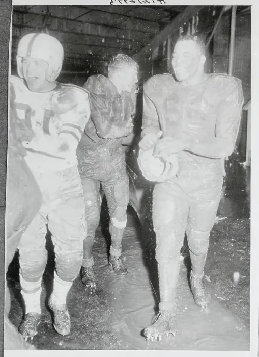 Framed Print : Football Players Covered in Mud Framed Print : Football Players Covered in Mud