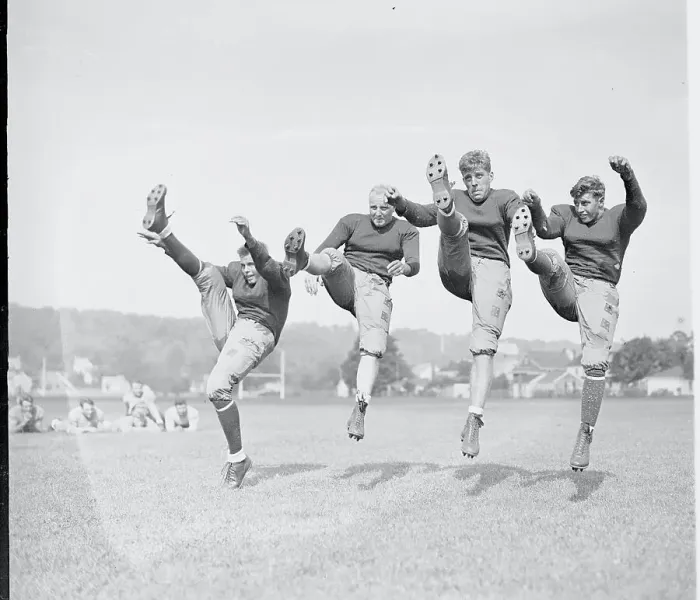 Framed Print : Football Players Practicing Kicking Framed Print : Football Players Practicing Kicking