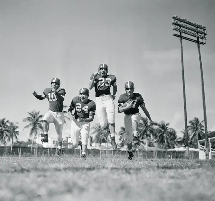 Framed Print : Football Players Running Framed Print : Football Players Running