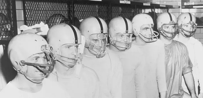 Framed Print : Football Players Standing in a Row and Wearing Helmets Framed Print : Football Players Standing in a Row and Wearing Helmets