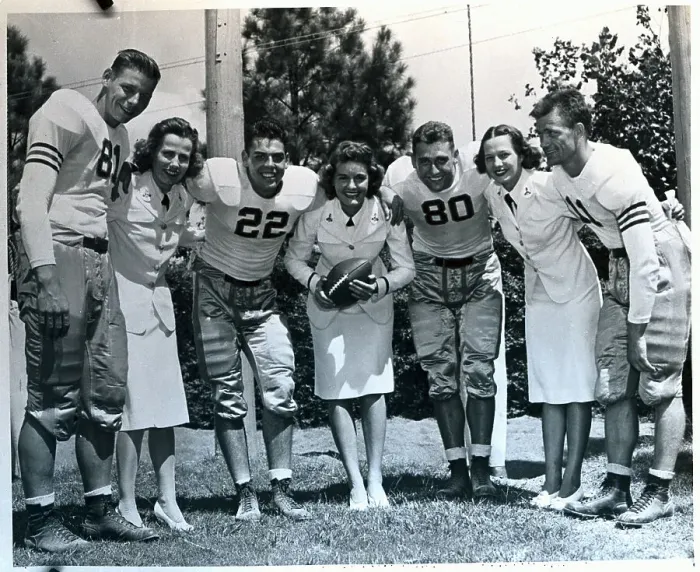Framed Print : Football Players With Women in Uniforms Framed Print : Football Players With Women in Uniforms