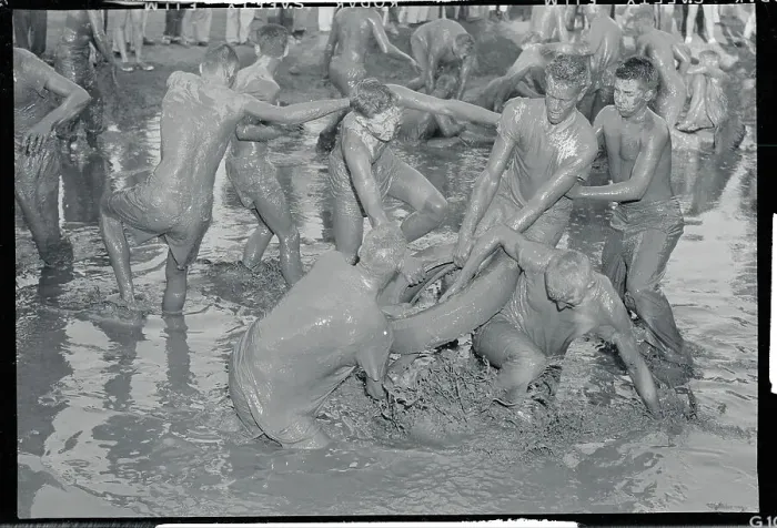 Framed Print : Football Players Wrestling in Mud Framed Print : Football Players Wrestling in Mud
