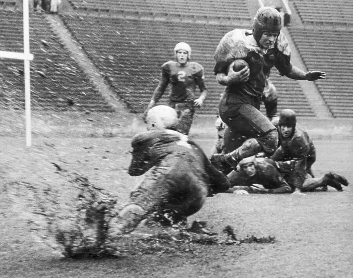 Framed Print : Football Tackle In Muddy, Rainy Weather Framed Print : Football Tackle In Muddy, Rainy Weather