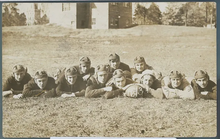 Framed Print : Football Team Posing on Grass Framed Print : Football Team Posing on Grass