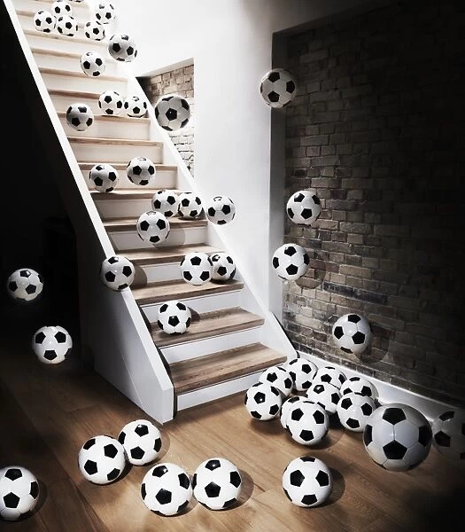 Footballs falling down from staircase