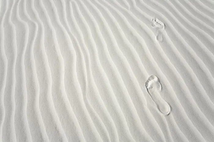 Framed Print : Footprints of barefoot hiker on white gypsum sand dune Framed Print : Footprints of barefoot hiker on white gypsum sand dune