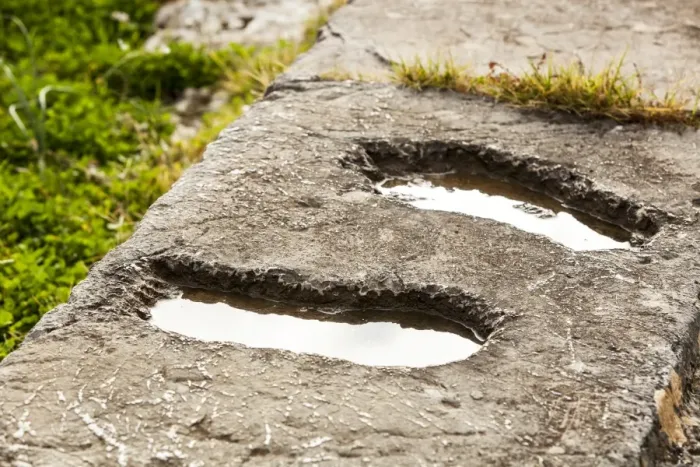 Framed Print : Footprints in a stone wall filled with water Framed Print : Footprints in a stone wall filled with water