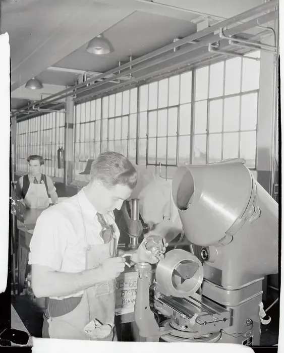 Framed Print : Ford Employee Examining Machinery Framed Print : Ford Employee Examining Machinery