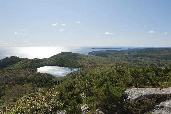 Forest and sea views from the summit of Champlain Mountain, 328 m, over The Bowl lake, hiking trail, Bear Brook Trail, Acadia National Park, Maine, New England, USA, North America