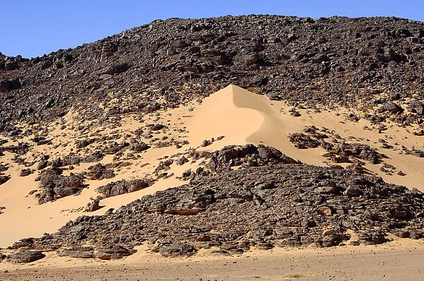 Formation of a sand dune in a desert rock, Hamada, Sahara, Libya, North Africa, Africa
