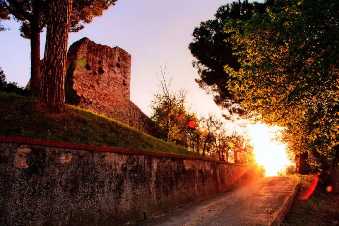 Framed Print : Fortress. Sun sets down road leading castle on hilltop fortress of San Framed Print : Fortress. Sun sets down road leading castle on hilltop fortress of San